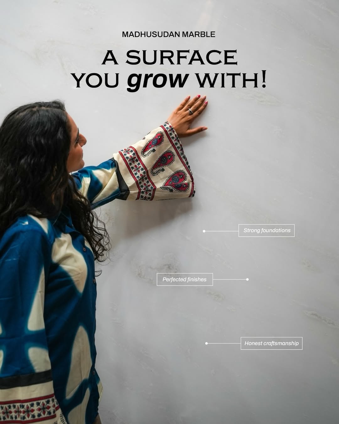 Hand on white marble surface